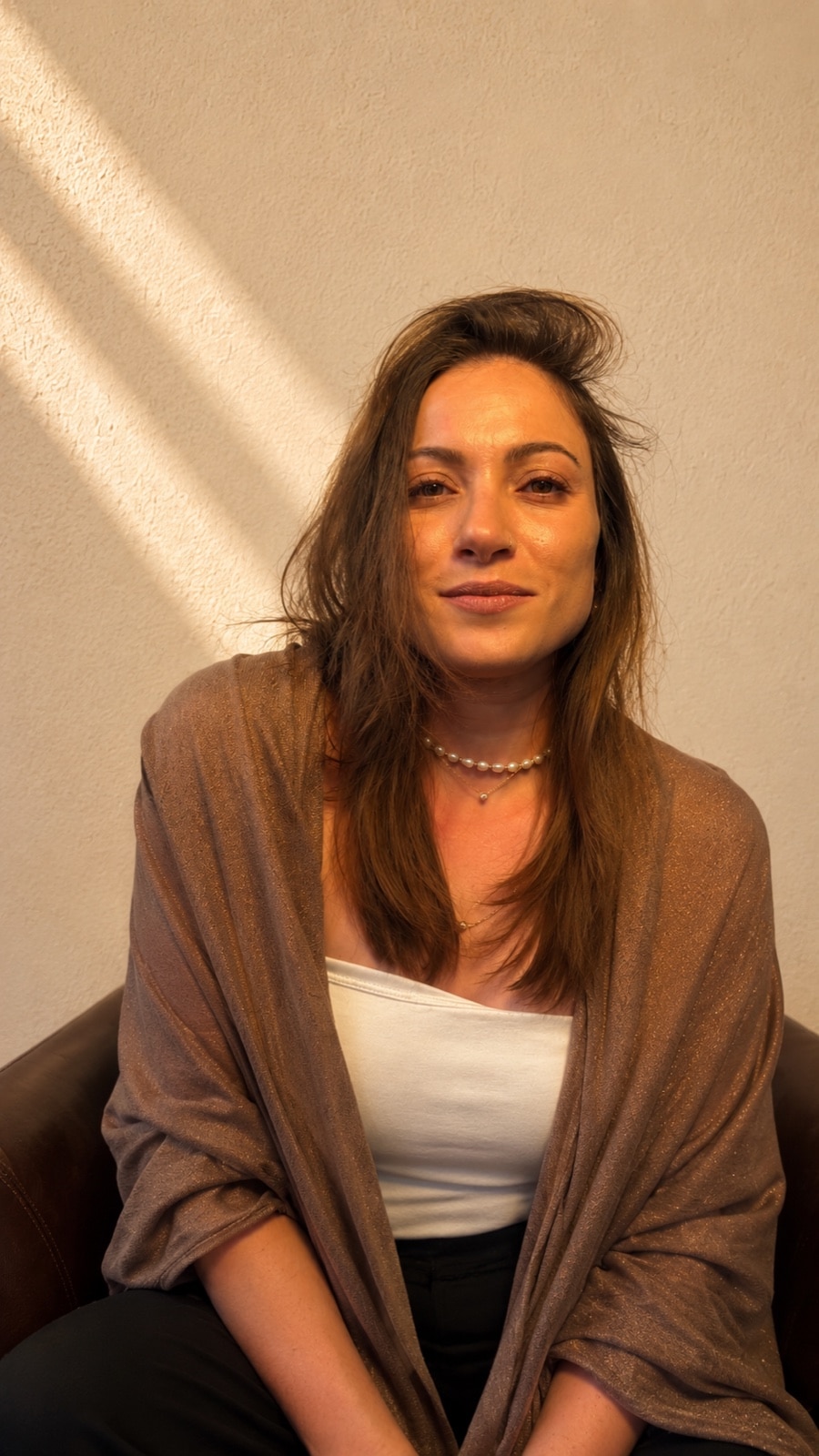 Shaena today, wrapped in a shawl, looking straight at you