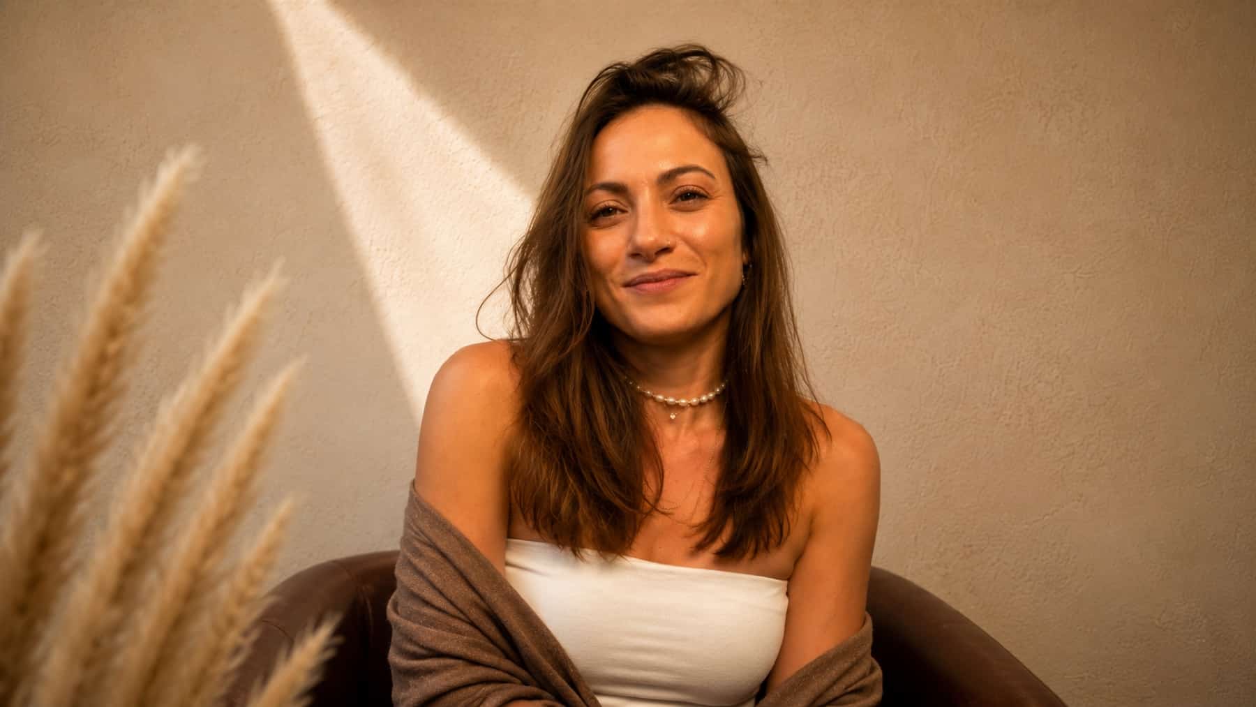 Shaena seated in the light, calm and unhurried