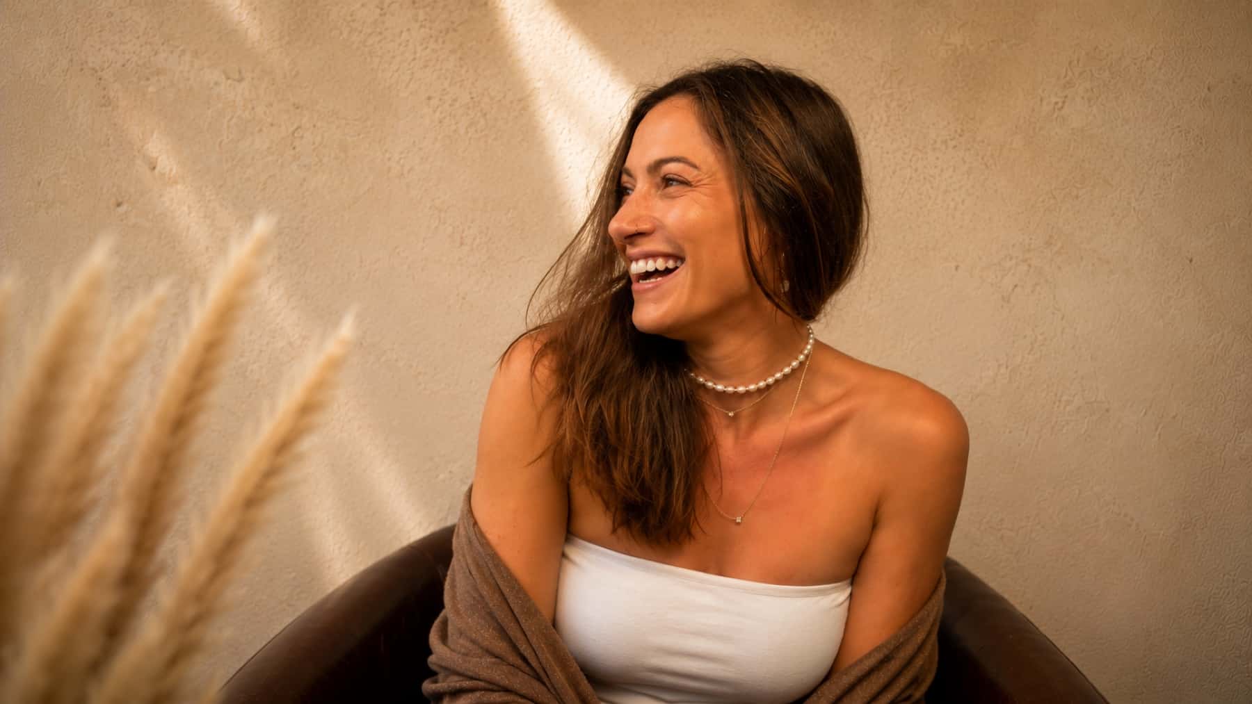 Shaena laughing, mid-conversation